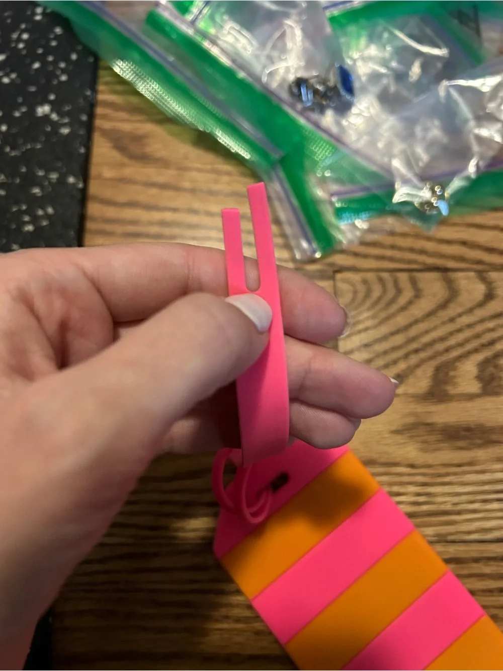 Kate Spade pink and orange luggage tag with flaw